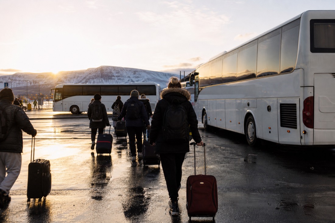 Tour coaches waiting in early light near the BSÍ terminal in Reykjavík