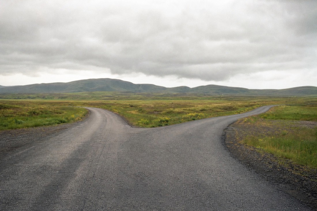 Road junction near Selfoss where the Golden Circle and South Coast routes split under a wide grey sky