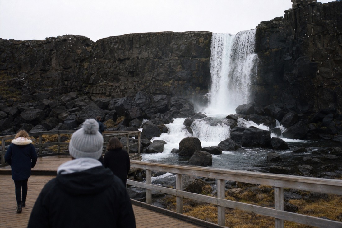 Öxarárfoss waterfall pouring over the basalt wall of the Almannagjá gorge at Þingvellir